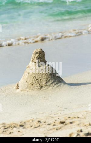 A sandcaste shaped like a mountain or possibly a nuclear reactor, Varadero Beach, Cuba. Stock Photo