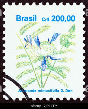 BRAZIL - CIRCA 1990: A stamp printed in Brazil from the 'Flowers' issue shows Jacaranda mimosifolia, circa 1990. Stock Photo