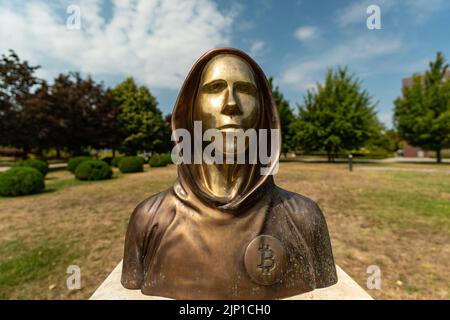 Budapest, Hungary -August 7, .2022:  Portrait of the statue of Satoshi Nakamoto mysterious founder of Bitcoin and Blockchain technology in; created by Stock Photo