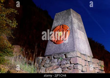 The Red Rose marker stone is at the border of Lancashire & Yorkshire on the M62 motorway & was opened by the Queen in 1971. Stock Photo