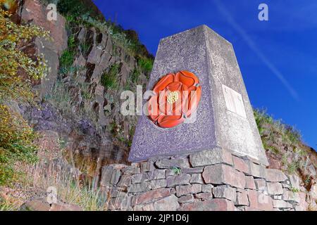 The Red Rose marker stone is at the border of Lancashire & Yorkshire on the M62 motorway & was opened by the Queen in 1971. Stock Photo