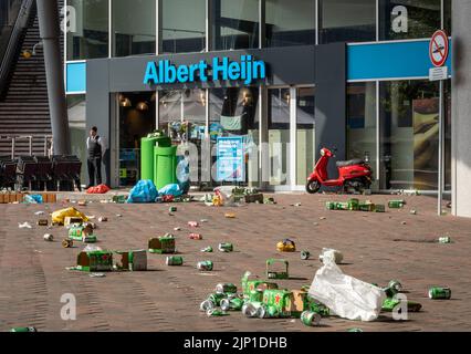 Amsterdam, The Netherlands, 14.08.2022, Front view of Albert Heijn Dutch supermarket chain at Johan Cruijff Boulevard, with trash in the street left b Stock Photo