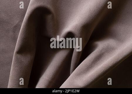 Brown wrinkled velor fabric for background, fabric for background macro photo Stock Photo