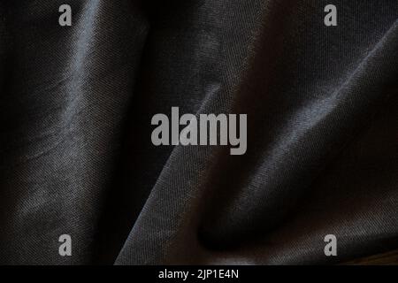 Gray black wrinkled velor fabric as background closeup, fashion and trends, gray background Stock Photo