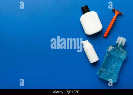 Composition with bath cosmetics on table. razor, toothpaste, soap, gel, toothbrush, mouthwash and other various accessories. Cosmetics for skin health Stock Photo