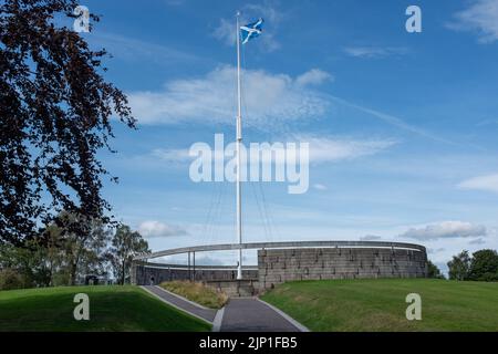 Scottish St Andrew's Cross flag flying over the rotunda at the  battlefield of Bannockburn, near Stirling in Scotland Stock Photo