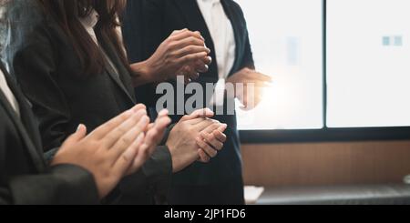 Photo of partners clapping hands after business seminar. Professional education, work meeting, presentation or coaching concept Stock Photo