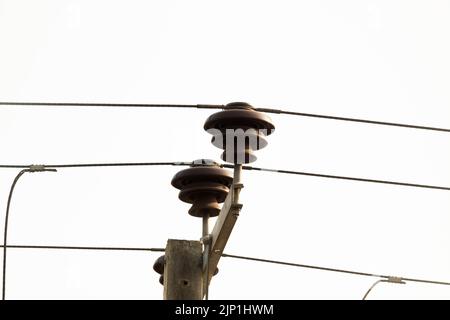 Overhead Electricity Lines with Insulators Stock Photo