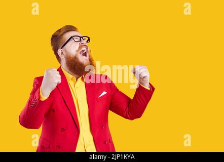 Crazy happy stylish bearded chubby man laughing out loud rejoicing in his success. Stock Photo