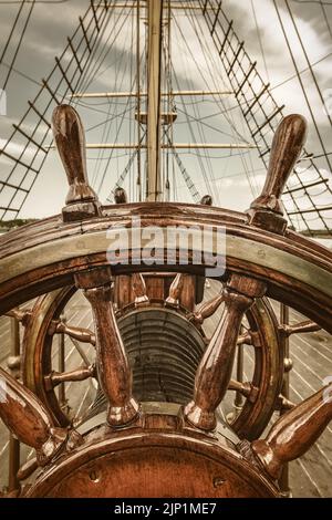 Retro styled image of the steering wheel of a sail boat Stock Photo