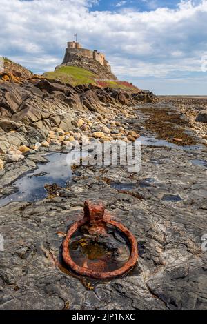 old mooring ring on shore at lindisfarne castle holy island Stock Photo