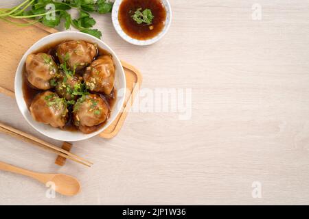 Bawan (Ba wan), Taiwanese meatball delicacy, delicious street food, steamed starch wrapped round shaped dumpling with pork and shrimp inside and thick Stock Photo