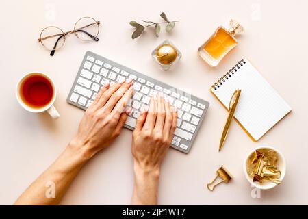Female hands working on office table. Layout of blogger or designer desktop Stock Photo