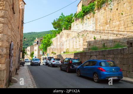 Olmeto, France - August 25, 2018: Street view photo with old living houses and parked cars taken on a summer day, Olmeto commune in the Corse-du-Sud d Stock Photo