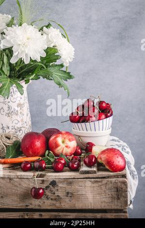 Still life with bouquet of flowers and fruits Stock Photo - Alamy