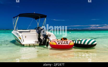 Boat In Green Water On Mauritius Beach, Postcard Motive Stock Photo