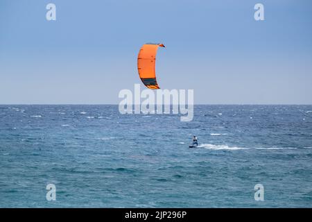 Man kitesurfing in Agiokampos beach of Aegean sea,Greece Stock Photo