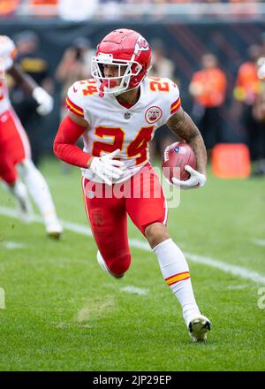 Kansas City Chiefs' Skyy Moore (24) flexes before their NFL football game  against the Arizona Cardinals