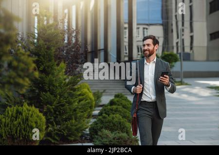 Satisfied Businessman in suit going home after long working day and looking at side Stock Photo