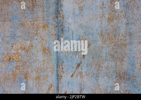 rough light-blue peeling paint on rusted flat sheet metal surface Stock Photo