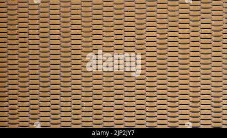 orange color expanded metal mesh wall background Stock Photo