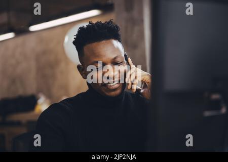 Young Business African people talking phonecall calling and using communication technology in office work happy smile. Stock Photo