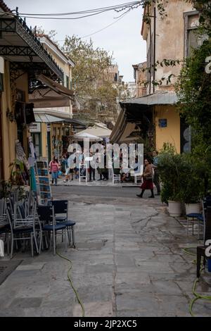 A vertical shot of a crowded narrow street in the beautiful Athens, Greece Stock Photo