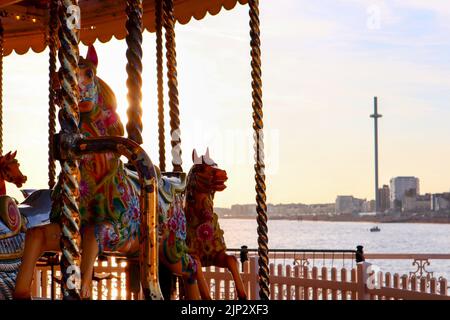 A merry-go-round attraction at the Brighton Palace Pier during the Brighton Pride, United Kingdom Stock Photo