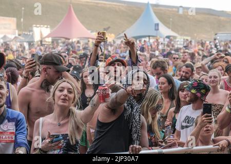 Winchester, UK. 14th Aug, 2022. Crowds of youngsters in costumes seen singing and dancing at Fair Festival. Boomtown is a British music festival held every year on the Matterley Estate in South Downs National Park, near Winchester. (Photo by Dawn Fletcher-Park/SOPA Images/Sipa USA) Credit: Sipa USA/Alamy Live News Stock Photo