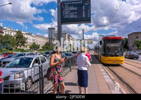 Warsaw, Poland, People, Women,  Waiting for Tram at Station, Street Scene, Old Town Center Stock Photo
