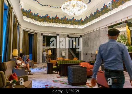 Warsaw, Poland, Man Walking inside, Luxury Lifestyle Hotel, 'Hotel Bristol', Wide Angle View Lobby Stock Photo