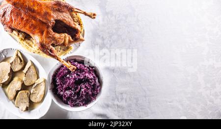 Roasted goose with red cabbage and stewed liver - Top of view. Stock Photo