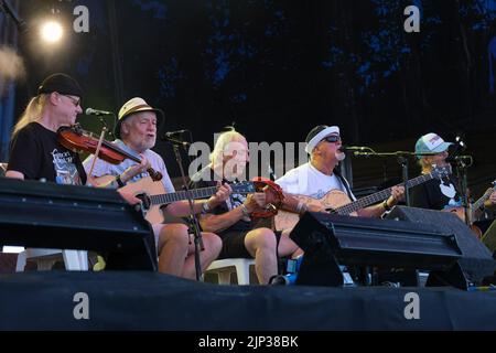 Ric Sanders, Simon Nicol, Gerry Conway,  Dave Pegg and Chris Leslie of Fairport Convention perform on stage at Fairport's Cropredy Convention. Banbury Stock Photo