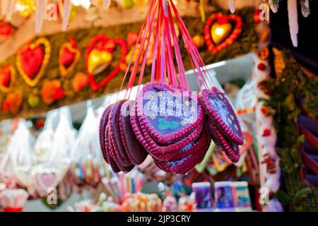 Heart-Shaped Gingerbread Cookies or Lebkuchen stall at Christmas market Striezelmarkt in Dresden, Saxony, Germany Stock Photo