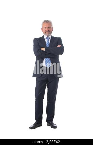 Full length portrait of confident mature businessman in formals standing isolated over white background Stock Photo