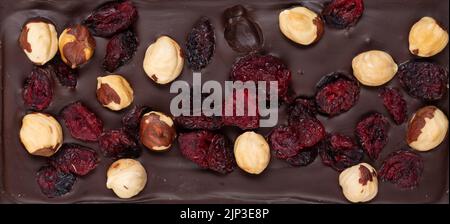natural dark dark chocolate with berries and nuts Stock Photo