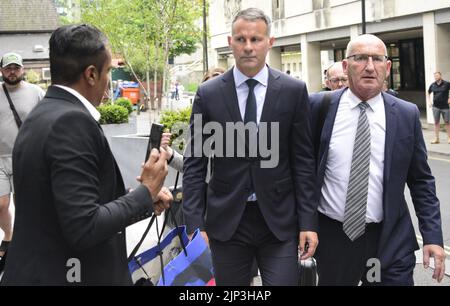 Manchester, UK. 15th August, 2022. Former Manchester United footballer and former Welsh manager Ryan Giggs (centre) leaves Manchester Crown Court, Manchester, United Kingdom, at the end of the 6th day of his trial. Ryan Giggs is accused of assaulting former girlfriend, Kate Greville, and her sister Emma Greville on November 1, 2020, and of using controlling and coercive behaviour against Kate Greville. He denies all the charges against him. Credit: Terry Waller/Alamy Live News Stock Photo