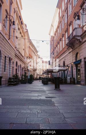 A vertical shot of a narrow Austrian style streets in Trieste, Italy Stock Photo