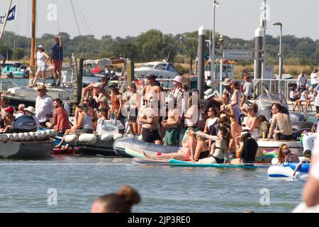West Mersea Town Regatta on Mersea Island in Essex. Crowds enjoying the sunshine on regatta day.