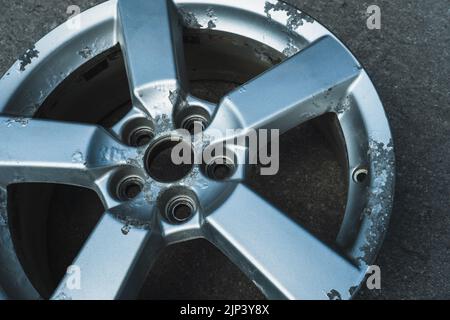 Corrosion on a silver aluminum alloy wheel close-up Stock Photo