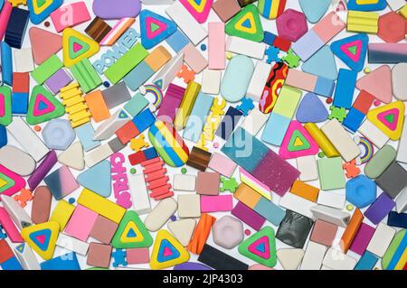 various shapes and colors of erasers on white background, top view Stock Photo
