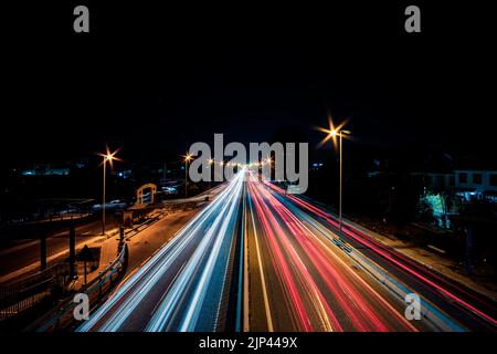 trails of car lights on the highway in Spain Stock Photo