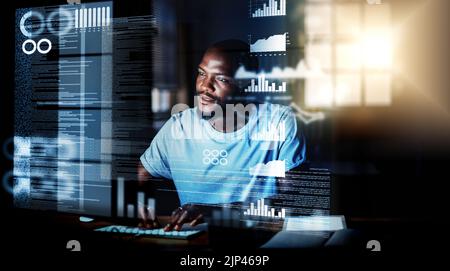 Computer programmer, software developer, or engineer working on computer database with futuristic CGI graphic data at night. Male information Stock Photo