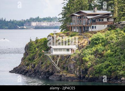 Campbell River, BC - 11 June 2022. Large home on water edge of Discovery Passage in Canada Stock Photo