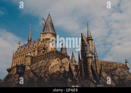 A dramatic shot of the Hogwarts castle in Universal studios Japan Stock Photo