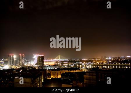 Panoramic night view on Belgrade, (Beograd in Serbian), or river Danube and old but also new part of town Stock Photo