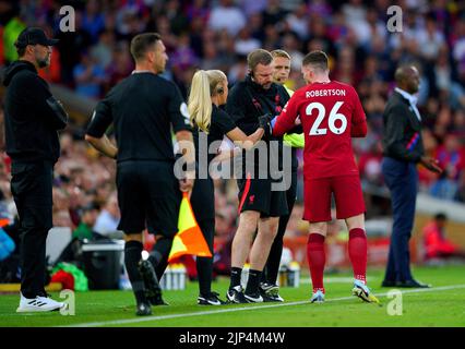 Liverpool's Andrew Robertson receives medical attention during the Premier League match at Anfield, Liverpool. Picture date: Monday August 15, 2022. Stock Photo