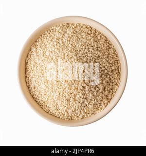 Top view of white sesame seeds in a beige bowl cutout. Raw organic  grains on a plate isolated on a white background. Sesamum indicum crop. Top view. Stock Photo