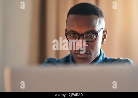 Freelance web designer with laptop thinking of website ideas, planning webpage and coding on technology while working from home. Serious, ambitious or Stock Photo