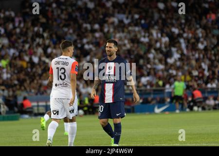The player Lionel Messi facing another player from Montpellier Stock Photo